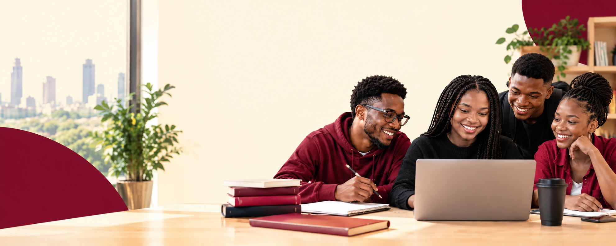 Four young Nigerian professionals gathered around a laptop in a bright study space